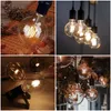 A collage of four images showcasing vintage-style LED light bulbs in various settings. Produktbild-Vorschau