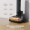 A close-up of a black vacuum cleaner head with internal heating elements visible, set against a light-colored background with descriptive text and icons. Produktbild-Vorschau