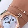 Guess Aura Montre pour femme GW0047L2, cadran en nacre, or Voir les images du produit 10