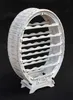 A white barrel-shaped wine rack against a black background. Produktbild-Vorschau