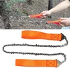 A person is using a portable hand chainsaw to cut a tree branch in an outdoor setting. Náhled obrázku produktu