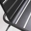 A close-up view of a gray metal garden bench. Produktbild-Vorschau