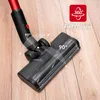 Close-up of a vacuum cleaner head on a wooden floor, demonstrating its maneuverability. Voir les images du produit