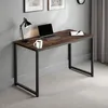 A modern desk with a laptop, mug, and lamp. Náhled obrázku produktu