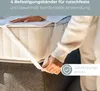 A person's hands are shown securing a white strap to a mattress, likely demonstrating a feature of a heated blanket. Produktbild-Vorschau