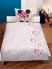 A child's bed with Minnie Mouse themed bedding. Produktbild-Vorschau