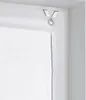 Close-up of a white roller blind with a gray decorative stitch and a metal ring attached to a hook. Produktbild-Vorschau