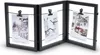A black, tri-fold photo frame with wires and clips holding three small photos. Produktbild-Vorschau