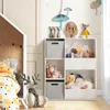 A child's bedroom with a toy storage unit and bed. Podgląd zdjęcia produktu