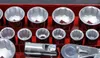 A close-up view of a set of sockets and a ratchet in a red toolbox. Produktbild-Vorschau