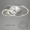 A modern LED ceiling light with multiple interlocking rings, shown against a plain background with technical diagrams. Produktbild-Vorschau