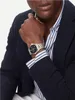 A man wearing a suit and watch. Produktbild-Vorschau