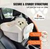 A small white dog sits in a car seat booster designed for pets. Podgląd zdjęcia produktu