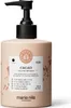 A bottle of Maria Nila Cacao Colour Refresh hair mask with a pump dispenser, shown against a white background with some brown splatters on the bottle. Produktbild-Vorschau