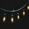 A string of vintage-style LED light bulbs hanging against a dark background. Podgląd zdjęcia produktu