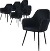 A set of six black velvet dining chairs with ribbed backs and black metal legs are arranged on a white background. One chair is in the foreground, angled towards the viewer, while the other five are grouped behind it. Náhled obrázku produktu