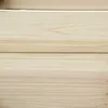 A close-up view of light-colored wooden planks, showing the grain and texture. Produktbild-Vorschau