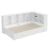 A white daybed with a built-in bookshelf and drawers, shown from a diagonal angle against a white background. Produktbild-Vorschau