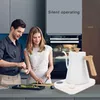 A couple is preparing food in a modern kitchen, with a white electric kettle on the counter. Náhľad obrázku produktu