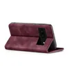 A burgundy flip case for a smartphone is shown from the side, propped open. Produktbild-Vorschau