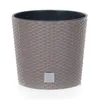 A close-up studio shot of a gray planter pot with a woven texture. Anteprima dell’immagine prodotto