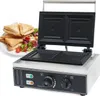 A sandwich maker with sandwiches and salad on a plate next to it. Produktbild-Vorschau