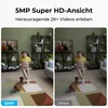 A split image showing a comparison of video quality from a security camera. The left side shows a child and a dog in a living room with the label '5MP', and the right side shows the same scene with the label 'Others'. Produktbild-Vorschau
