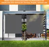 A gray vertical awning is installed on a modern pergola on a sunny day, with a lawn in the foreground and a building in the background. Produktbild-Vorschau