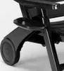 A close-up view of the wheel and a small tray attached to a black plastic lounge chair. Produktbild-Vorschau