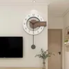 A modern living room with a wall clock, television, and a plant in a vase. Produktbild-Vorschau