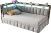 A modern upholstered daybed with integrated LED lighting and shelving. Podgląd zdjęcia produktu