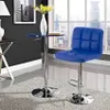 A blue bar stool and a small table are placed in a room with a large window overlooking a city skyline. Produktbild-Vorschau