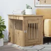A wooden dog crate is placed next to a sofa in a living room. Produktbild-Vorschau