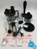 An overhead shot of a hand blender and its accessories laid out on a white surface. Produktbild-Vorschau
