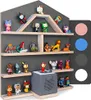 A display shelf filled with various small figurines and a grey audio device, arranged on shelves against a dark grey background. Produktbild-Vorschau