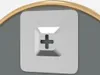 A close-up view of a screw head with a cross shape, set against a gray background with a golden curved element at the top. Náhled obrázku produktu