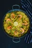 A paella dish in a pan, viewed from directly above. Podgląd zdjęcia produktu