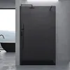 A modern bathroom with a black walk-in shower, a black bathtub, and concrete walls. Anteprima dell’immagine prodotto