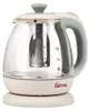 A transparent glass electric kettle with a cream base and handle, and a green lid and accents. It has a built-in infuser and water level markings. Anteprima dell’immagine prodotto