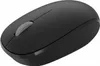 A black wireless computer mouse is shown from a slightly elevated side angle against a white background. Produktbild-Vorschau