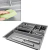 A collage showing a close-up of a hand cleaning a sink and a top-down view of a cutlery organizer filled with utensils. Produktbild-Vorschau