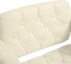 Close-up of a tufted cream-colored upholstery on a chair or stool. Produktbild-Vorschau