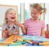 Two young girls are drawing at a table with markers. Anteprima dell’immagine prodotto
