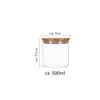 A clear product shot of a glass jar with a bamboo lid, featuring measurement indicators. Produktbild-Vorschau