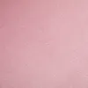 A close-up, textured view of a pink fabric. Produktbild-Vorschau