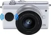 A white digital camera with a silver lens. Anteprima dell’immagine prodotto