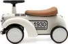 A side view of a retro-style baby ride-on toy car. Produktbild-Vorschau