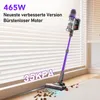 A purple cordless vacuum cleaner is shown on a carpeted floor, cleaning up debris. The background features blinds and a window. Produktbild-Vorschau