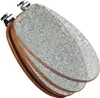 A toilet seat with a blue ornamental pattern and wooden edges, shown from a diagonal angle. Produktbild-Vorschau