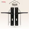 A product image featuring two black door handles with their mounting plates, set against a light beige and white patterned background. The image includes text and a logo, suggesting it's for marketing purposes. Produktbild-Vorschau